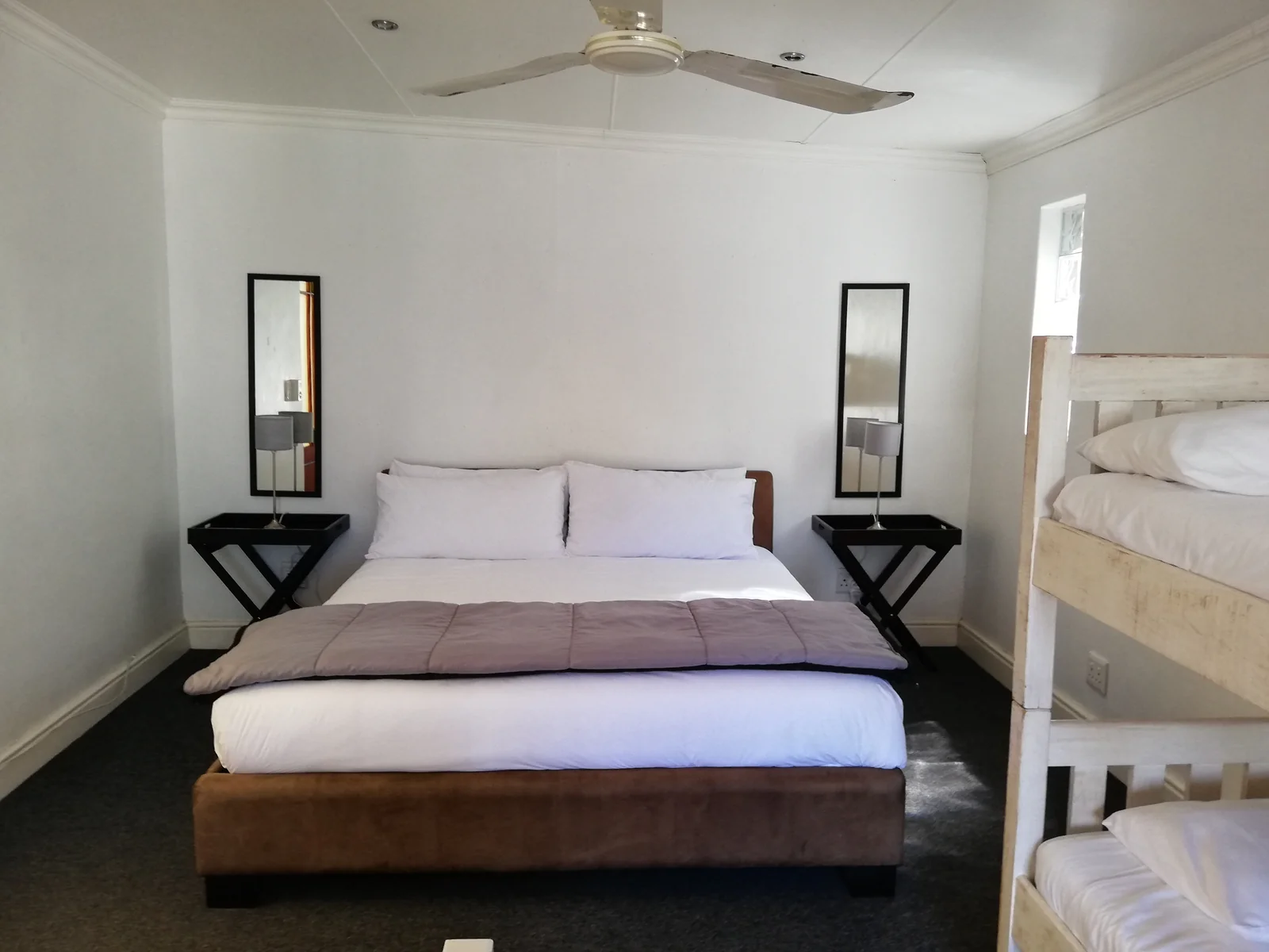 Family accommodation with a double bed and bunk beds